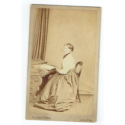 Victorian cdv photo young woman seated at desk Louth photographer