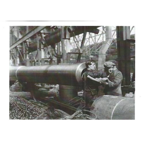 Q 30134: A female munitions worker is lifted into the barrel of a 15-inch naval.