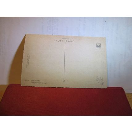 SEA-FRONT AT NIGHT, BRIGHTON, SUSSEX unused postcard by Constance dated 1969 =