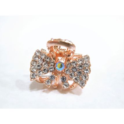 Small mini rose gold bow shaped hair claw clip with crystals