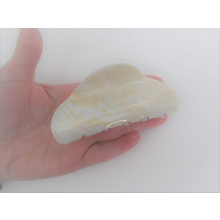 Long creme white blonde and gold hair claw clip