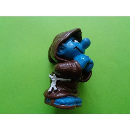 Smurf dressed up as a praying monk