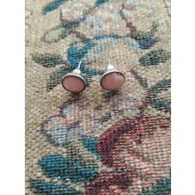 womens girls pierced with coral/peach coloured earrings
