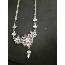 womans brand new necklace, missing white gem just above dangle bit, hard to see