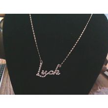 GOLD TONE CRYSTAL LUCK NECKLACE