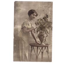 A YOUNG ENGLISH LADY VERY early 20th c .used postcard by Carlton publishing Co /