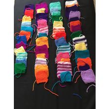 50 knitted squares in Various Colours Sizes.