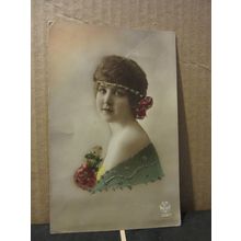 A PRETTY YOUNG GIRL WITH ROSES . used postcard 1923 Belgian pm =