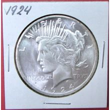 1924 Peace Dollar. This Coin is a replica and contains NO precious metal.