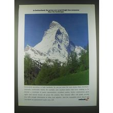 1989 SwissAir Airline Ad - In Switzerland, the prices are surprisingly less