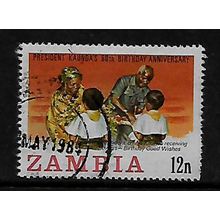 ZAMBIA 1984 BIRTHDAY PRESIDENT KAUNDA 12N RECEIVING FLOWERS SG 404 FINE USED