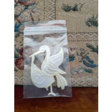 2 x embroidered motifs, stork and flower