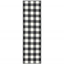 2' X 8' Black and Ivory Indoor Outdoor Area Rug