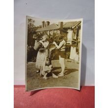 A COLD SHOWER IN THE GARDEN WITH BUCKET, 1930s? photograph =