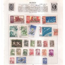 24 RUSSIA stamps on paper .all have been hinged in an album late 60/70's =