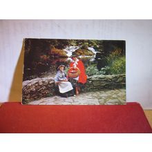 SAT ON A BRIDGE, WELSH NATIONAL COSTUME used postcard Colourmaster 1982 pm =