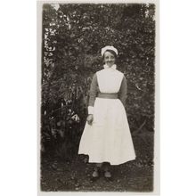 Grinning Nurse with Old Fashioned Bow Collar Real Photo Postcard