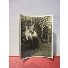 A MAN AND TWO WHITE RABBITS, 1930s? photograph =