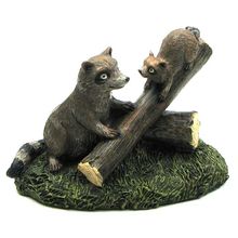 Resin Raccoons on Log