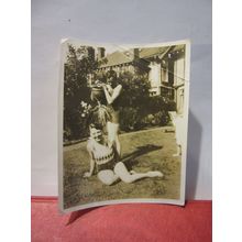A COLD SHOWER IN THE GARDEN WITH WATERING-CAN, 1930s? photograph =