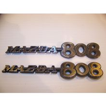 MAZDA 808 EMBLEMS PAIR OEM #752469053 1971 1972 1973 1974 1975 1976 1977 1978 ?