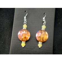 Multi faceted flat round orange crystal glass with yellow accent earrings
