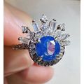Radiant Blue Gem W/Above Crown Accents Ring Bom...