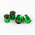4 X GREEN METAL TYRE VALVE DUST CAPS FORD RS ST...