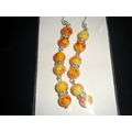Abstract red on round yellow glass & clear rhin...