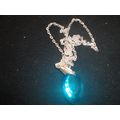 Stunning electric blue faceted oval pendant on ...