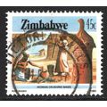 ZIMBABWE 1985: WOMAN CRUSHING MAIZE - 45c USED (G16)