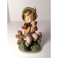Boy Sitting On Fence Playing Flute Porcelain Fi...