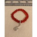 Red glass beads with guitar charm