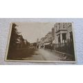 1920s Real Photo Postcard - High Street scene, ...