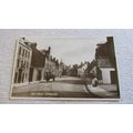 Early Bell real photo Postcard - High Street sc...