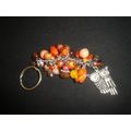 Large silver owl with brown orange pink bag pho...