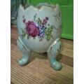 Figurine Three footed egg light blue with flora...