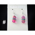 Asian style turquoise & gold on round pink glas...