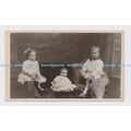 C014017 Family photo. Three small children