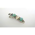Small turquoise blue stone and crystal metal al...