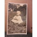 a young girl sat on the grass unused antique po...