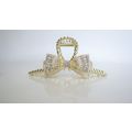 Long one sided crystal bow gold metal hair claw...