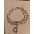 Light pink glass bead bracelet with heart charm