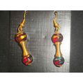 Unusual turquoise & gold on red asian glass wit...