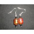 Delightful small emerald cut transparent orange...