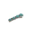 Smaller turquoise blue stone and silver metal a...