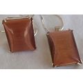 A brown cat eye set ring and pendant