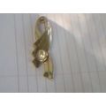 Brooch gold tone ribbon with faux white pearl