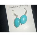 Delightful Turquoise dyed oval howlite drop ear...