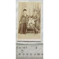 Carte-de-visite of a couple & baby in a garden ...
